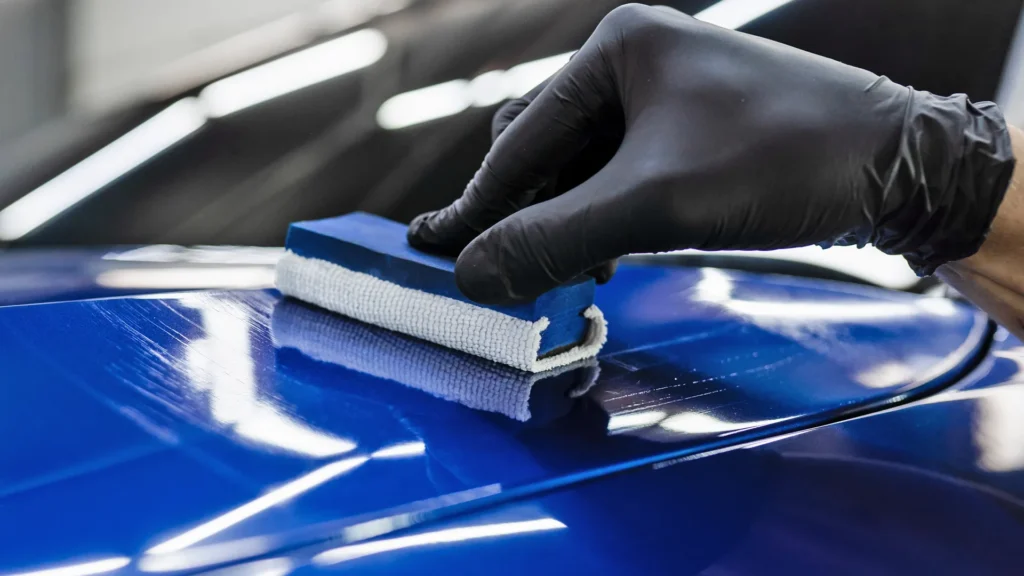 applying ceramic coating to a blue car Ceramic Coating Cost in Boise & Meridian: What to Expect & Why It Pays Off CITYNAME, STATE